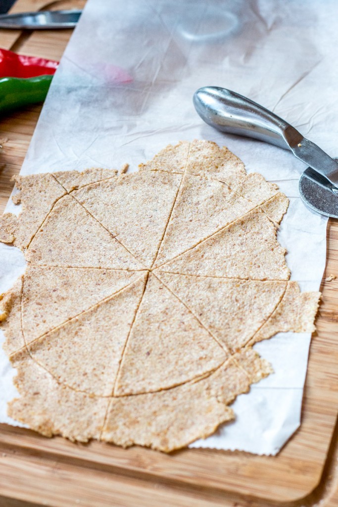 Easily make these crispy, flaxseed vegan and paleo tortilla chips and taco shells in less than 30 minutes, using just three simple ingredients!