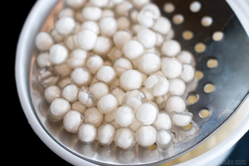 Closeup of partially cooked tapioca pearls on a strainer