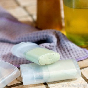 2 containers of homemade deodorant in front of a bottle of liquid soap