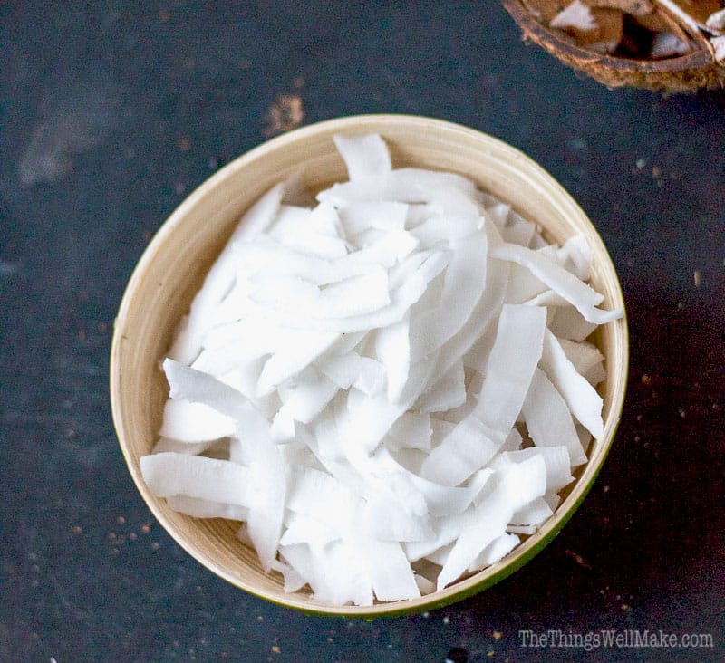 Overhead view of a bowl of homemade white coconut chips