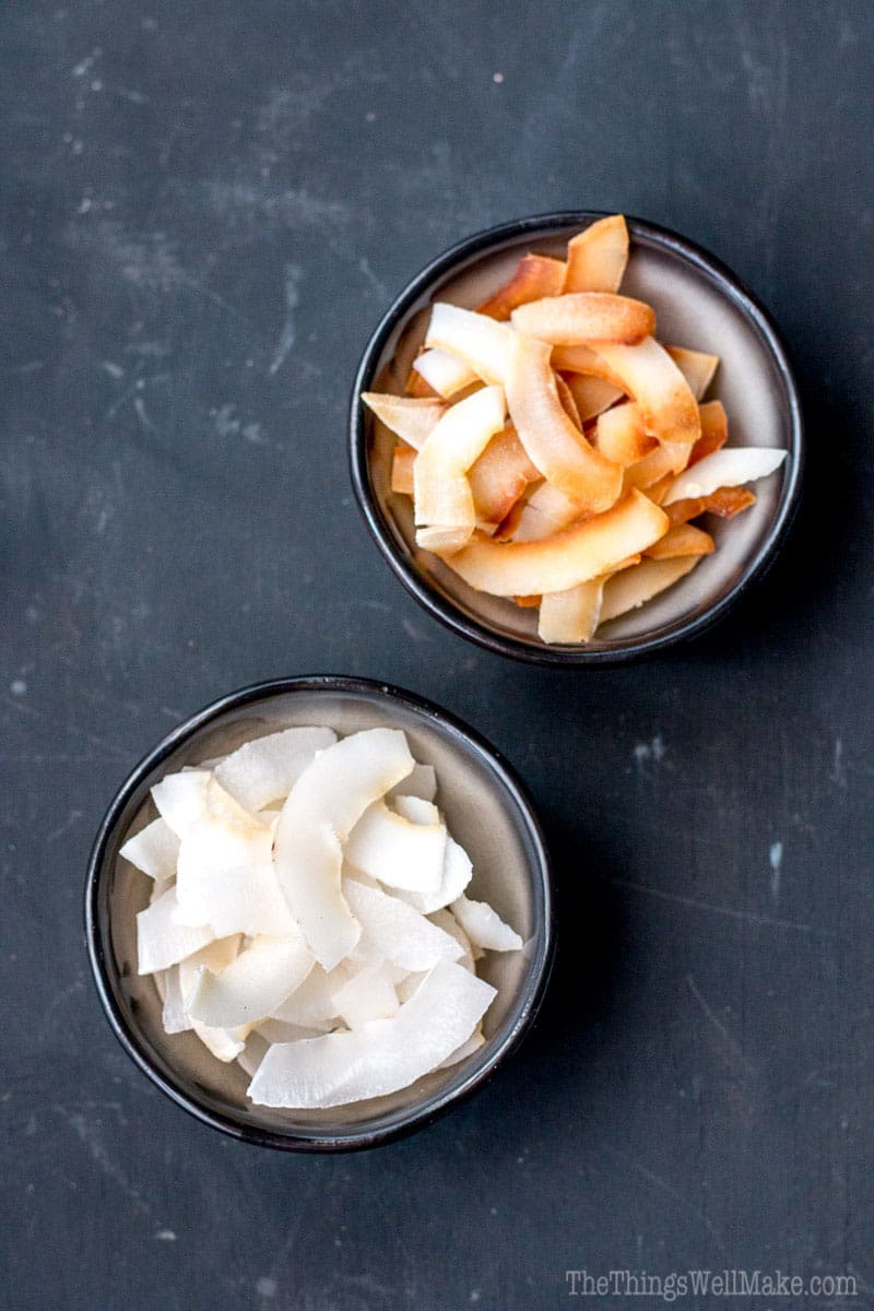 Overhead view of 2 bowls of coconut chips, one with toasted chips