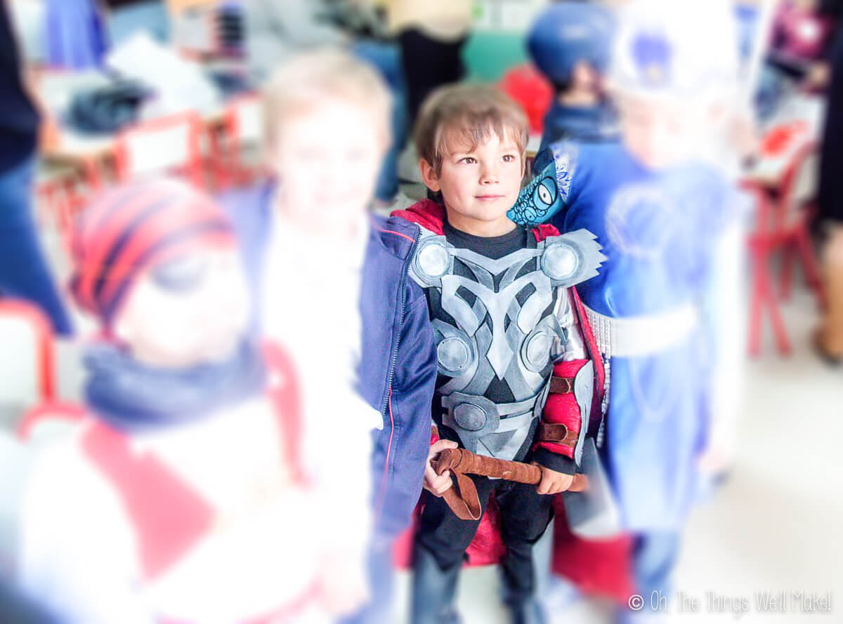 photo of kids dressed up as superheroes focusing on boy dressed in a homemade Thor costume