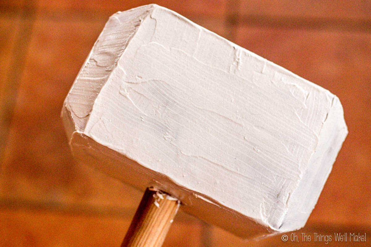 Photo of the paper mache Thor's hammer covered with wall putty to smooth it out.