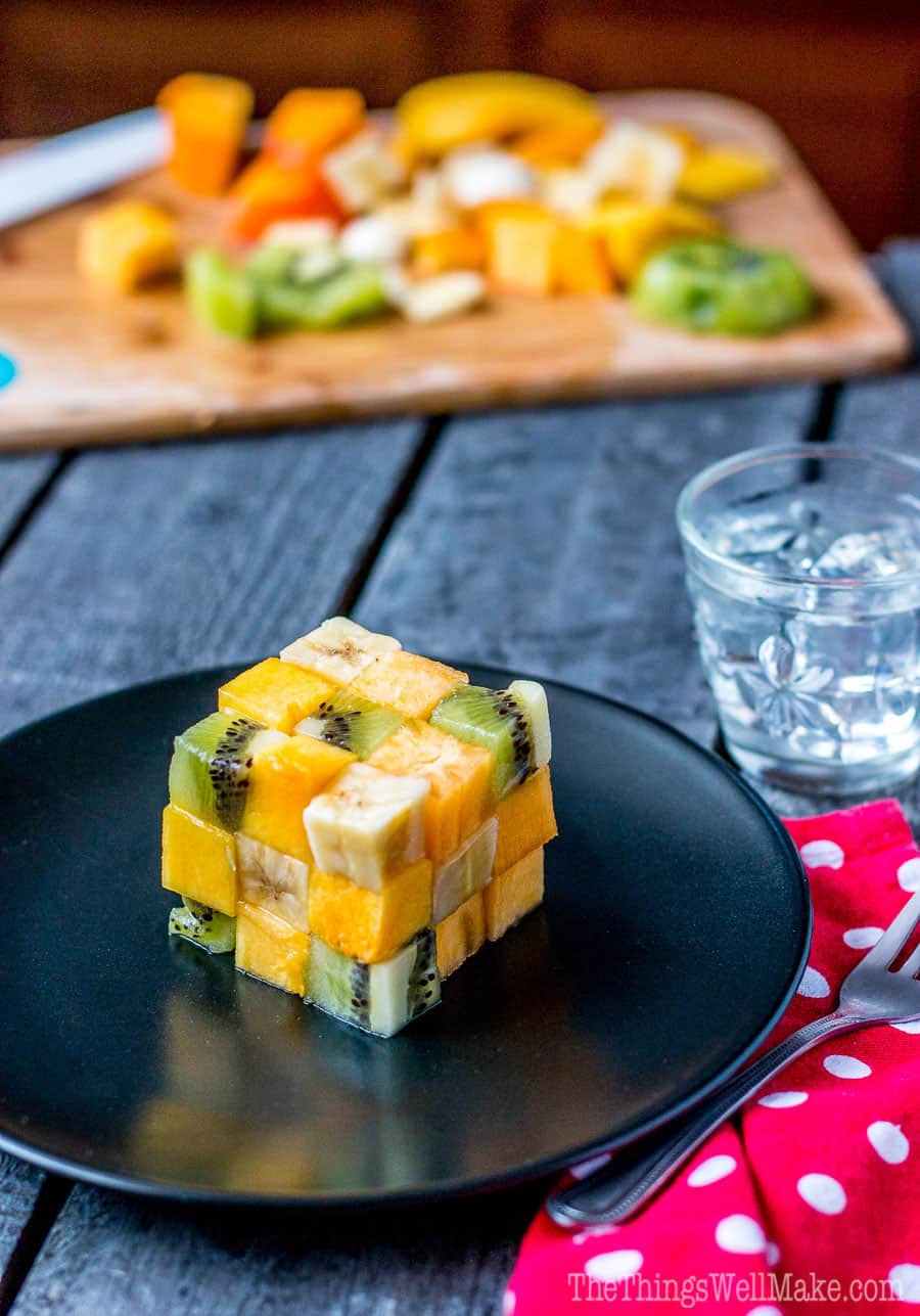 A rubik's cube fruit salad made from cubes of fruit.