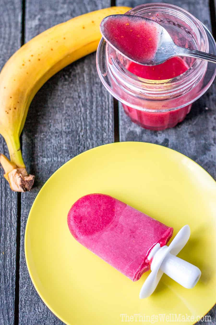 A fruit juice popsicles on a plate.