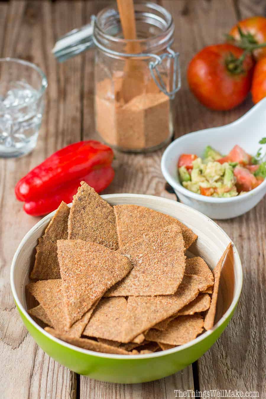 A bowl of paleo Dorito-like chips made of flaxseeds