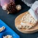 A tablet of homemade turrçon de Alicante (Hard Spanish almond nougat) wrapped in paper and decorated with baker's twine.