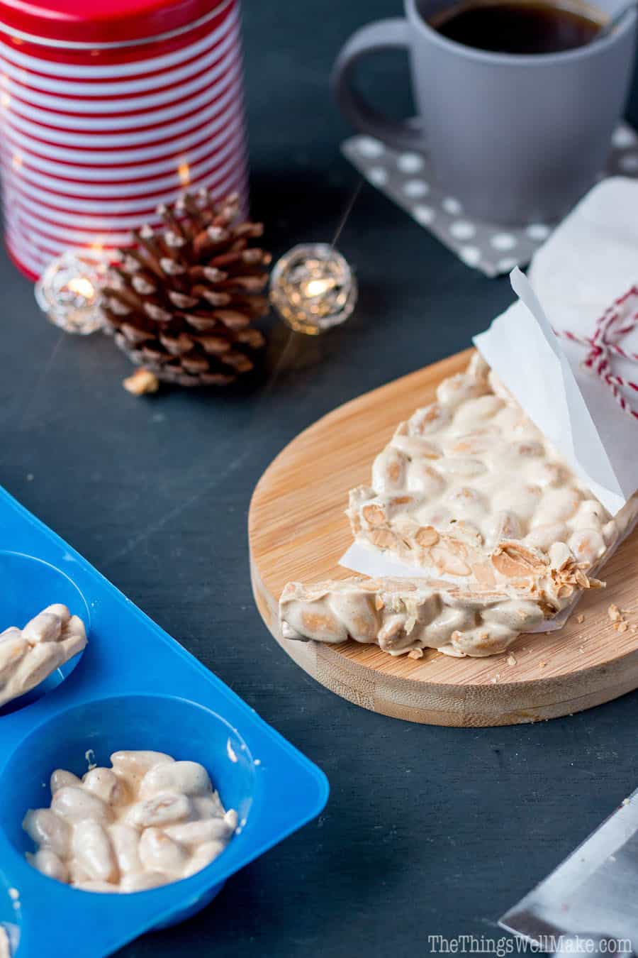 Turron de Alicane, hard turrón, on a bamboo cutting board.