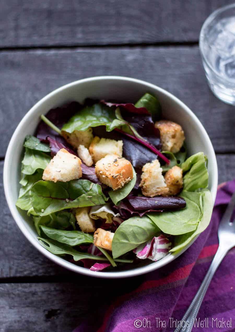 Overhead view of a salad with homemade croutons