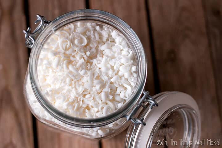 A jar filled with a grated coconut oil-based laundry soap