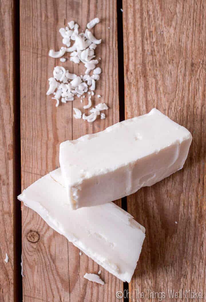 homemade coconut oil laundry soap bars next to grated soap.