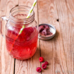 Ditch the unhealthy sodas, and switch to a much healthier paleo red pop, or red soda, which can be made two ways using a combination of herbs, fruits, and soda water.