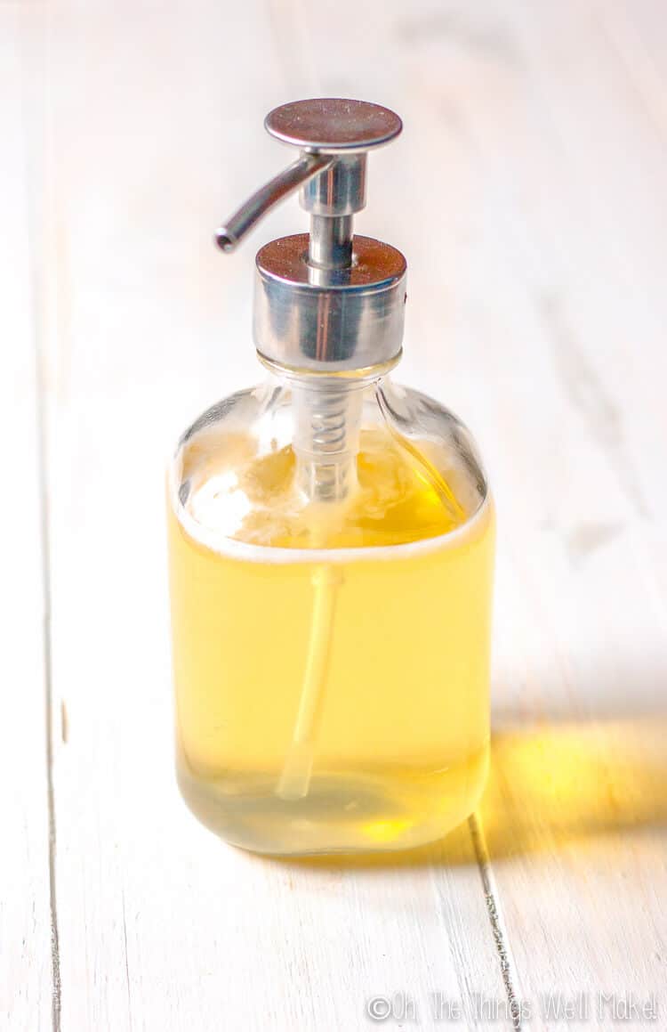 A glass bottle with a homemade liquid soap