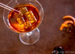 Dropping bitters into a cocktail glass