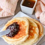 High protein yogurt panackes served with jam and maple syrup