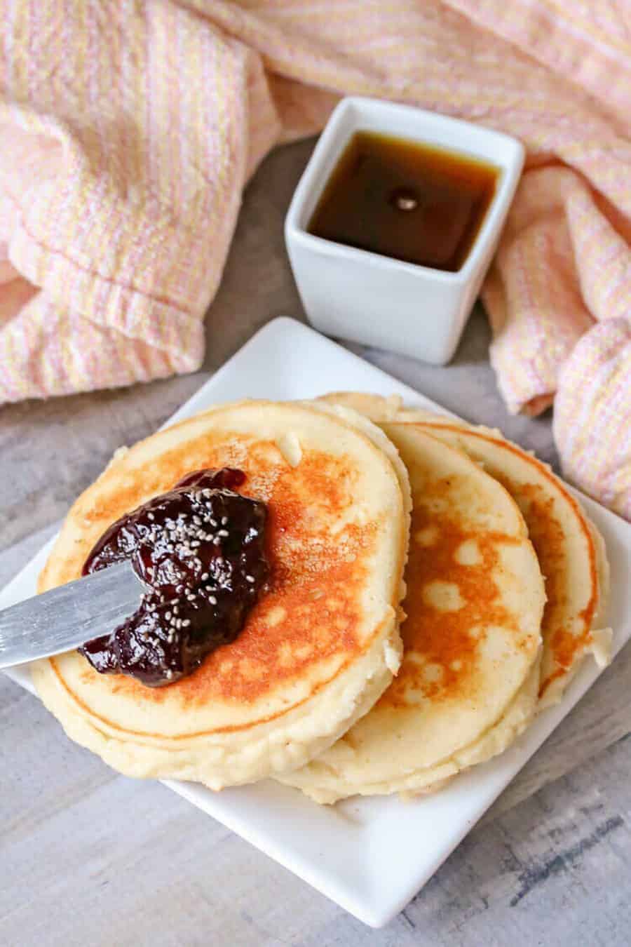 High protein yogurt panackes served with jam and maple syrup