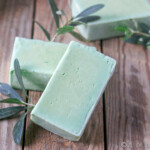 several bars of green laurel berry soap with olive leaves