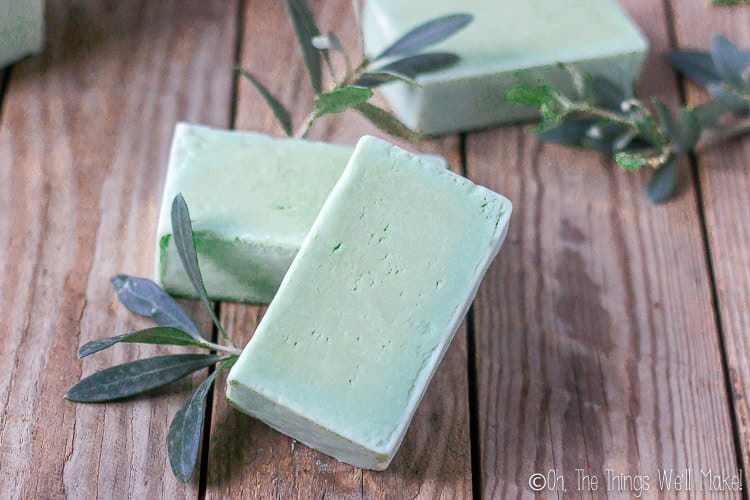 several bars of green laurel berry soap with olive leaves