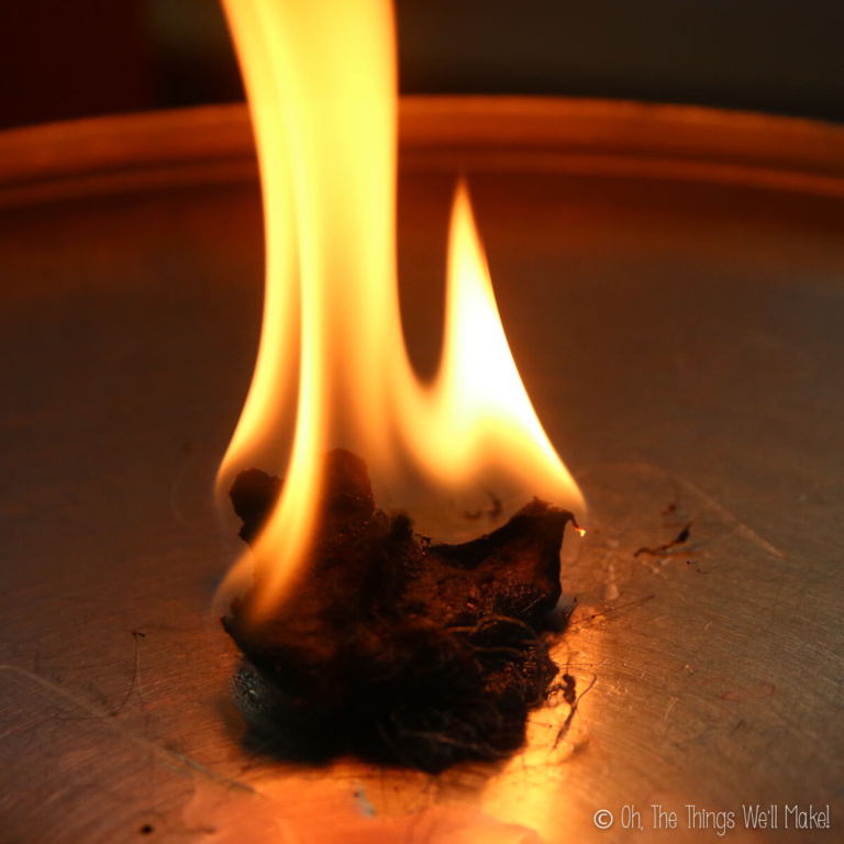 firestarter that has been lit and is flaming