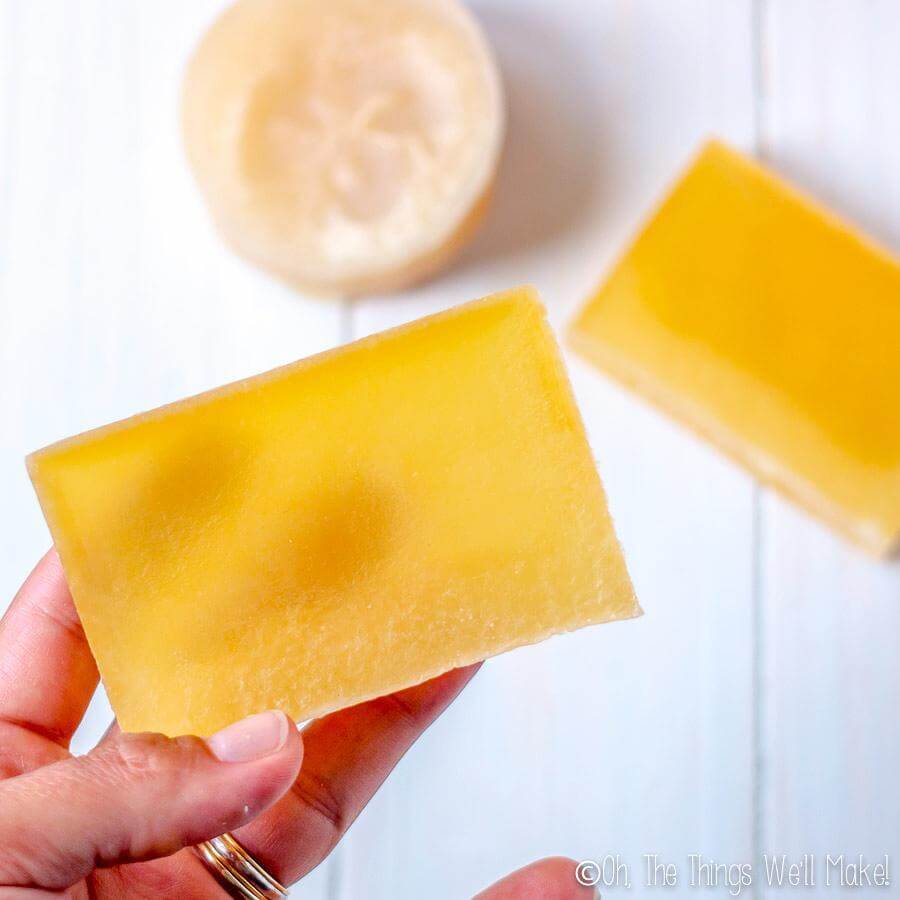 homemade glycerin soap being held up to show translucence