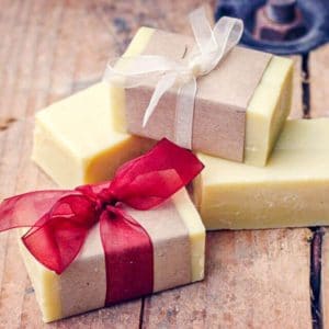 homemade bars of soap wrapped in brown paper and ribbons