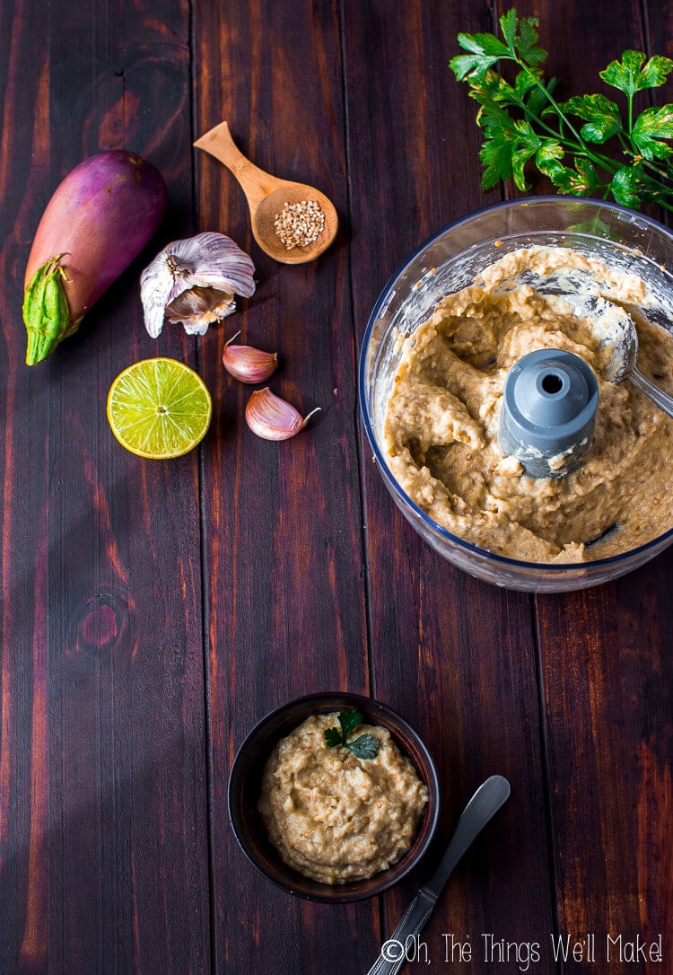 bowl of baba ganoush and food processor bowl as seen from above