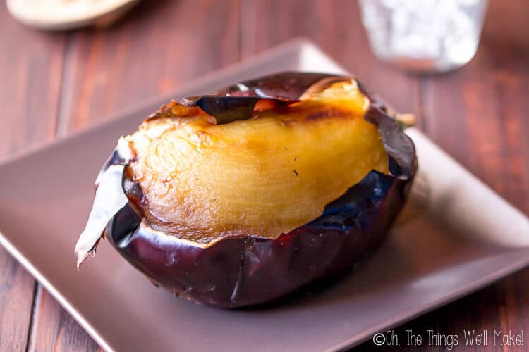 peeling the broiled eggplant