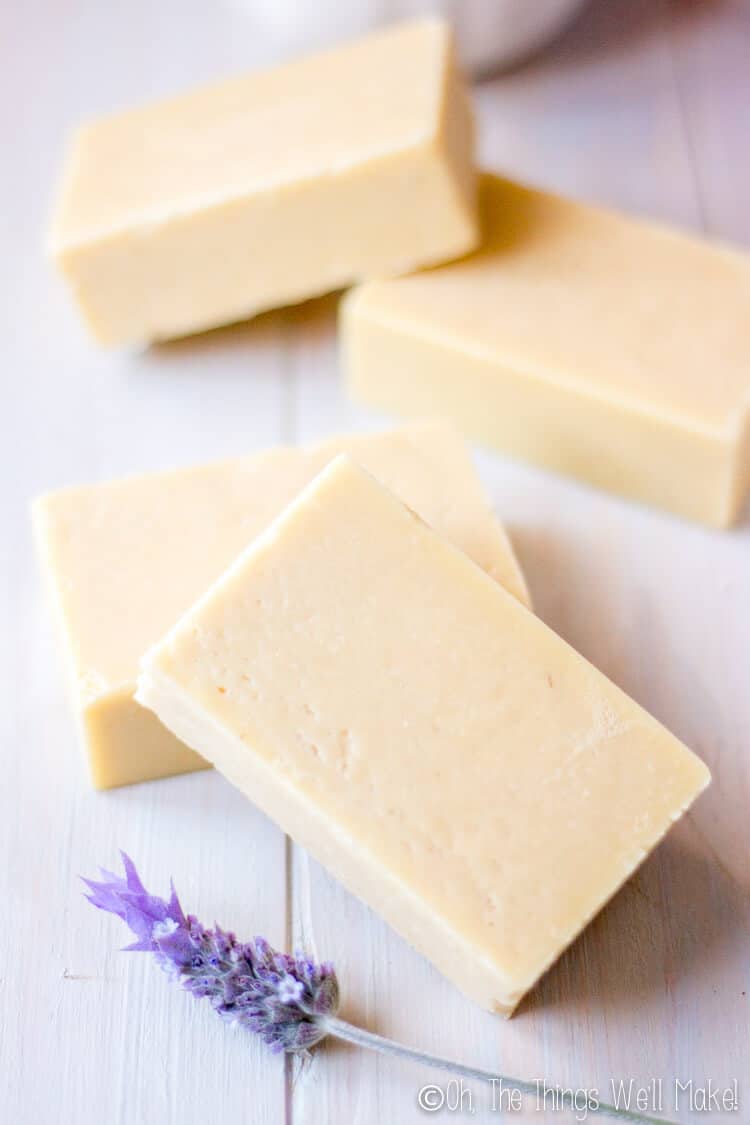 Closeup of several bars of goat milk soap with honey