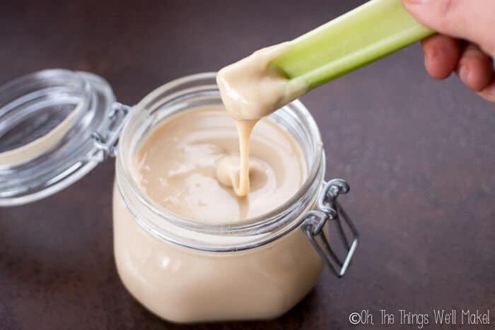 Raw almond butter in a glass jar.