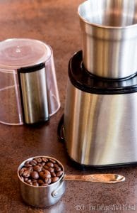 grinding the coffee beans in a coffee grinder