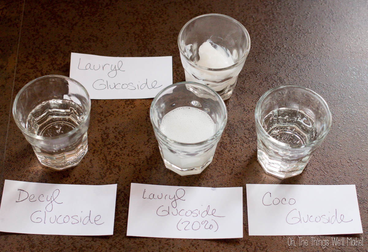 Shot glasses filled with Coco Glucoside, Decyl Glucoside, and Lauryl Glucoside showing the latter is thicker and more opaque