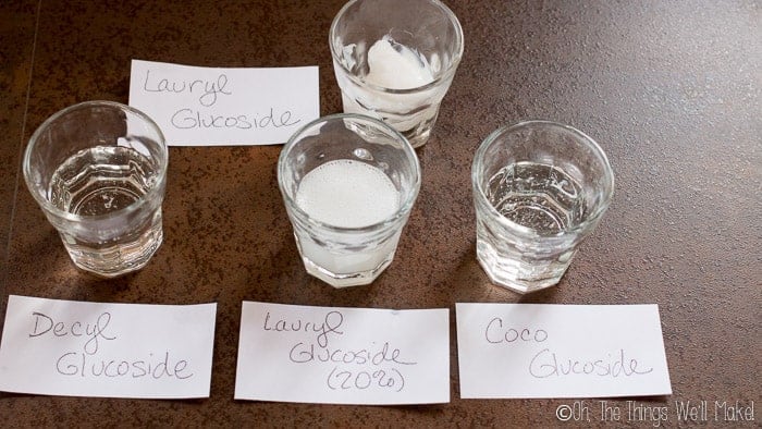 Shot glasses filled with Coco Glucoside, Decyl Glucoside, and Lauryl Glucoside showing the latter is thicker and more opaque