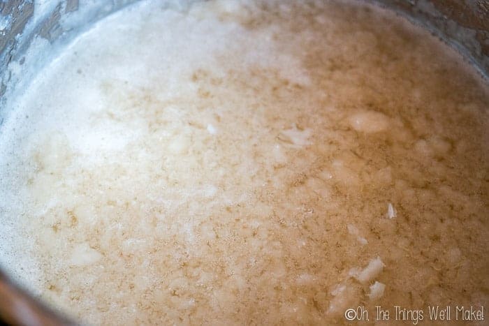 Homemade glycerin soap in a crock pot after having added the glycerin and alcohol.