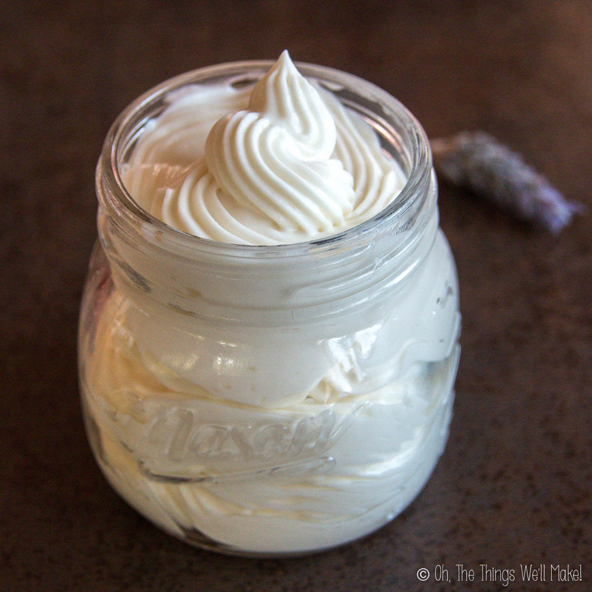 A jar filled with a creamy, smooth, DIY whipped body butter.