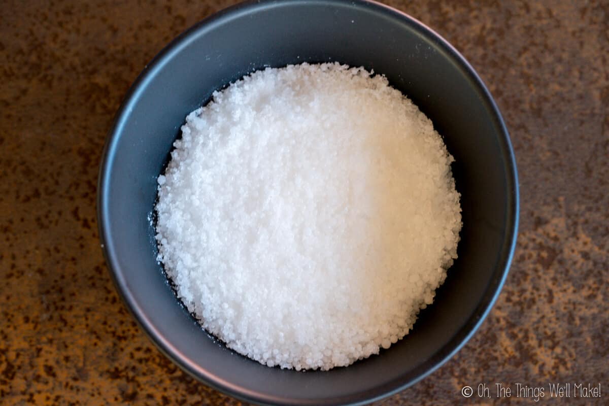 Sodium hydroxide beads in a bowl.