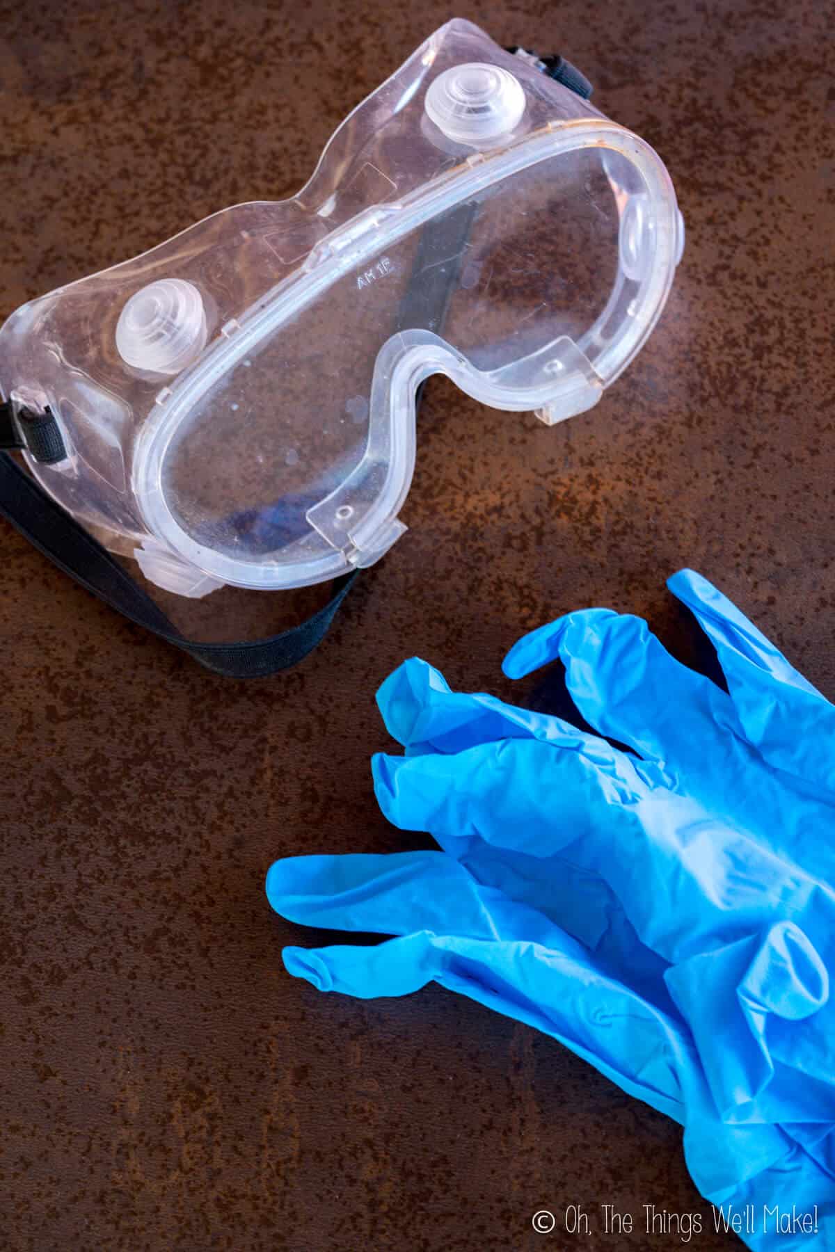 Overhead view of safety goggles and gloves