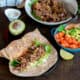 Homemade Chipotle Shredded Beef Tacos in flour tortillas.