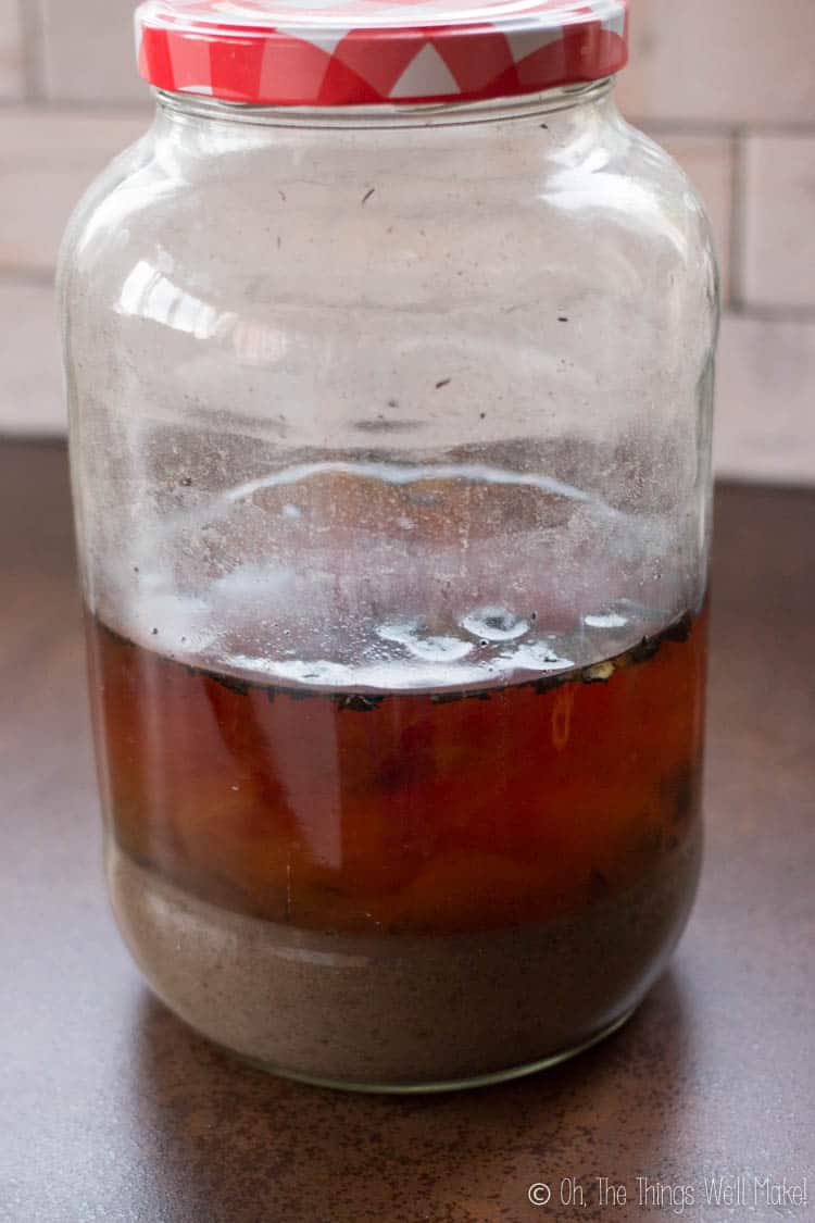 A big jar filled with ashes and water to make potash.