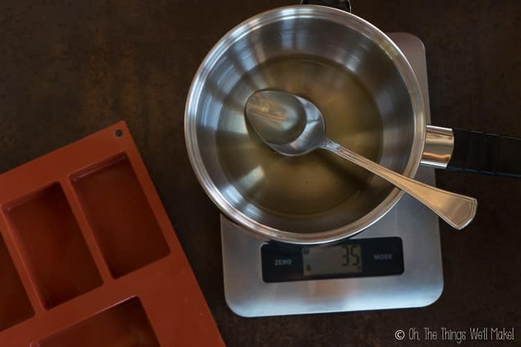 Melted ingredients for a homemade conditioner bar next to a silicone soap mold