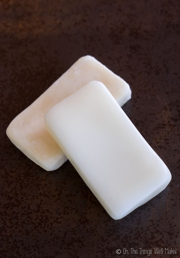 A homemade conditioner bar on top of a homemade shampoo bar