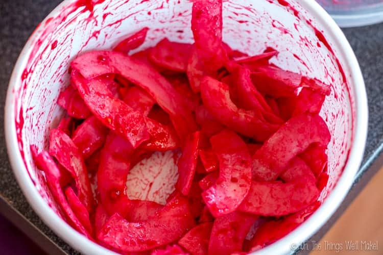mixing the raspberry puree mixture with the coconut chips