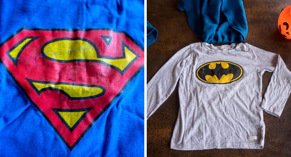 Homemade superhero T-shirts featuring a colorful Superman logo and a hand-painted black and yellow Batman logo.