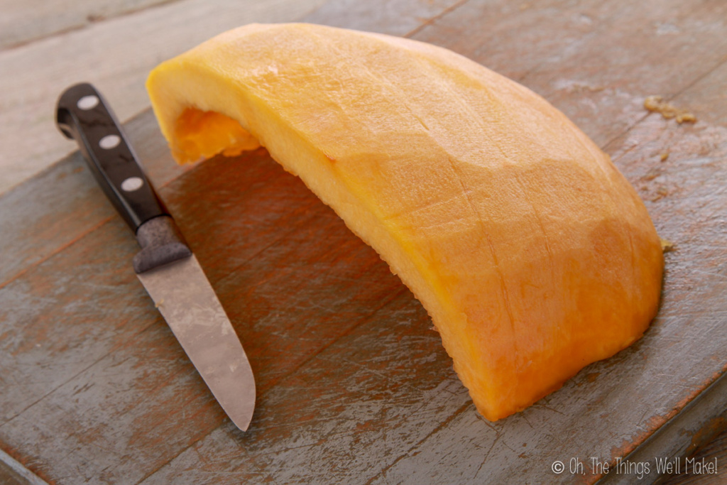Peeled pumpkin piece on a cutting board