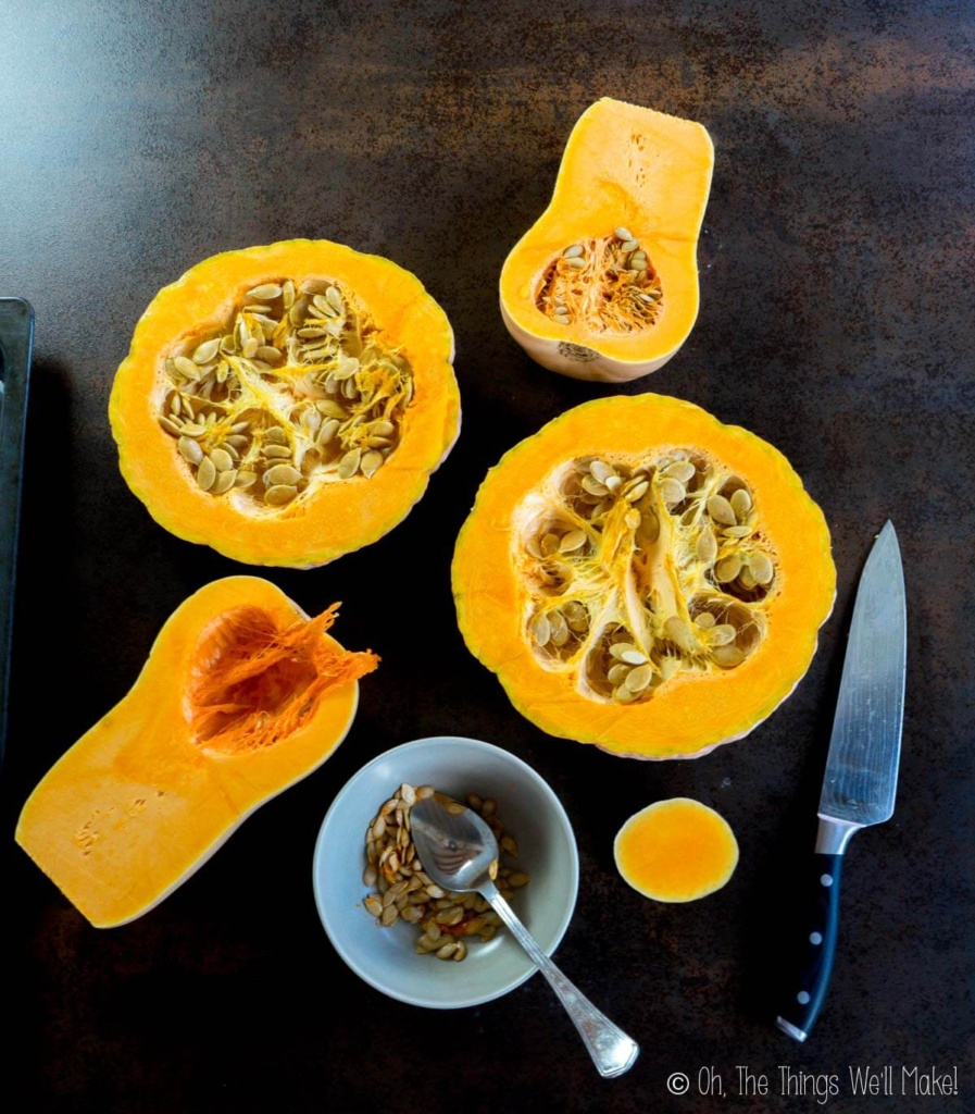 Various squashes cut in half, one with the seeds scooped out