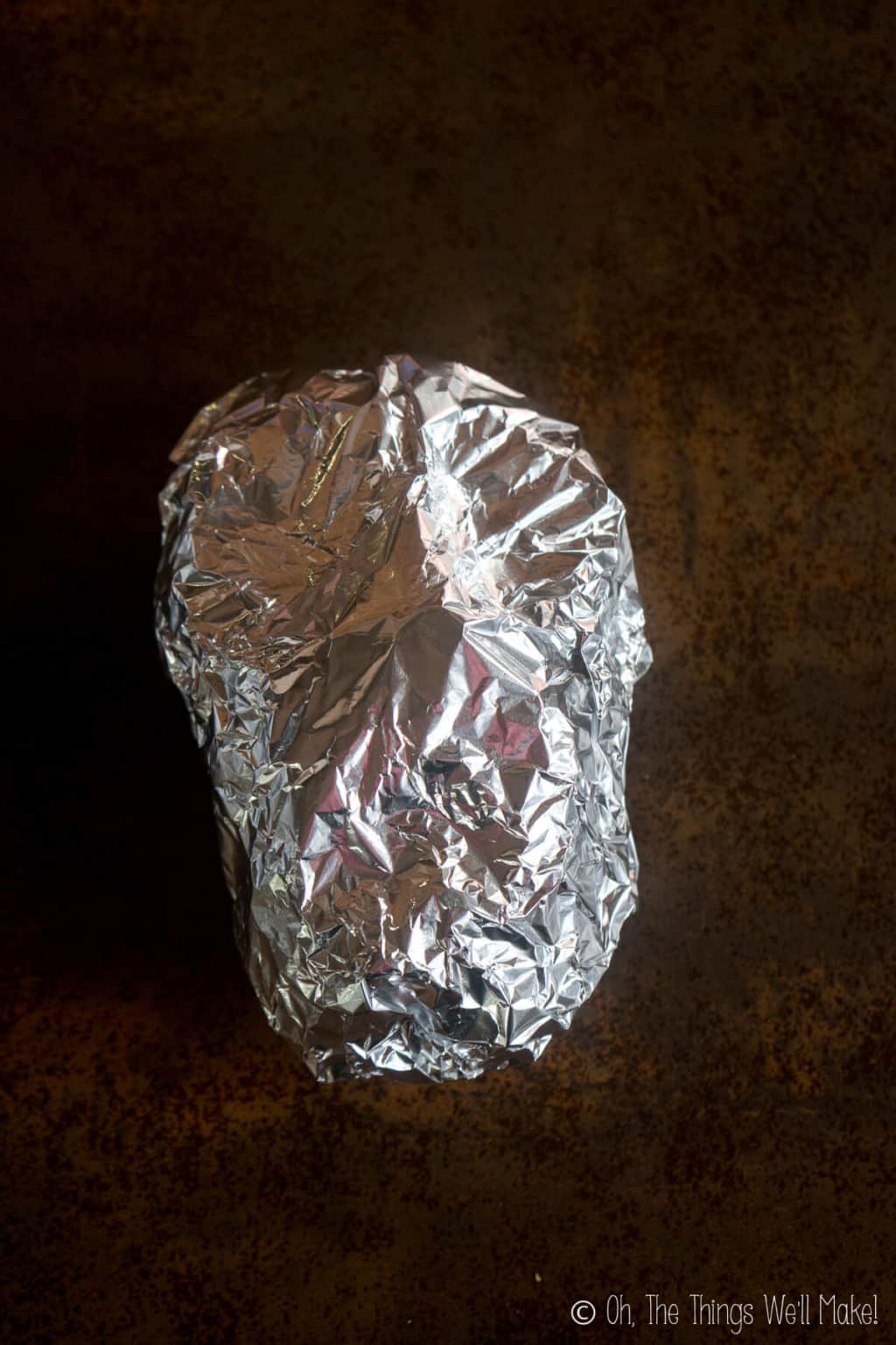 The finished look of a face shape covered with another piece of aluminum foil.