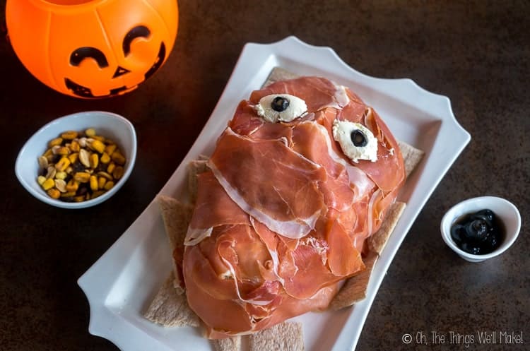 Overhead view of a creepy prosciutto face on a platter.