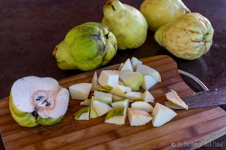 Slicing the quince into small pieces.