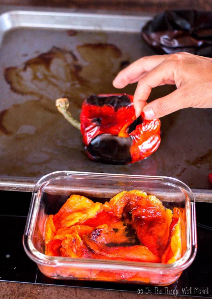 Peeling the char-broiled skin off the roasted peppers