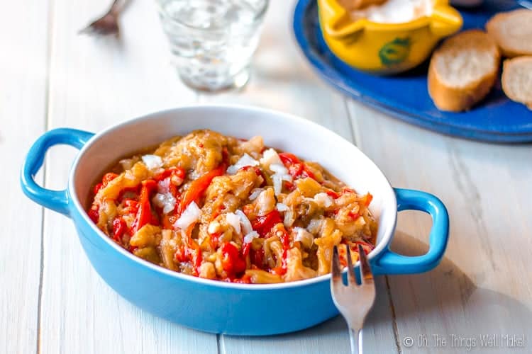 A casserole dish filled with espencat, a Spanish dish made from roasted red peppers, roasted eggplant, and salted cod. 