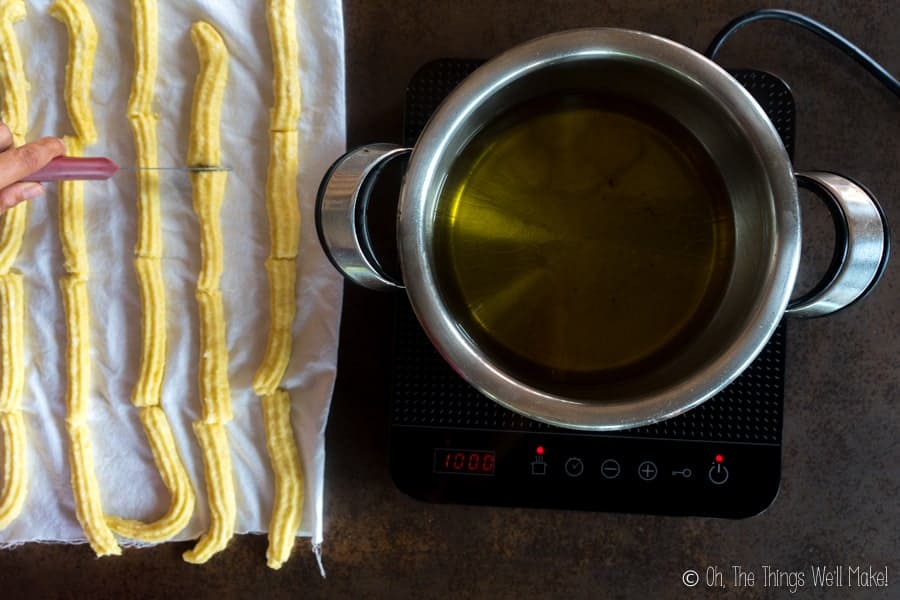 cutting the gluten-free churro dough into smaller pieces